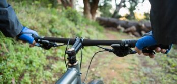 Close-up of male mountain biker riding bicycle