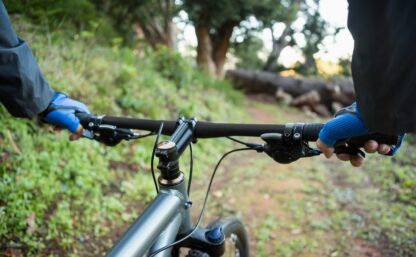 Close-up of male mountain biker riding bicycle